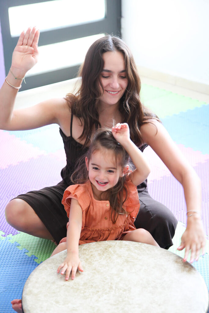 Daughter and Mother drumming together